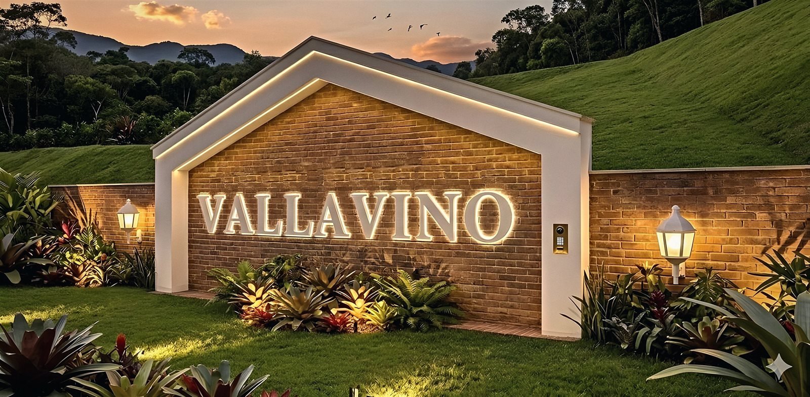 Muro de identificação com o nome Vallavino iluminado